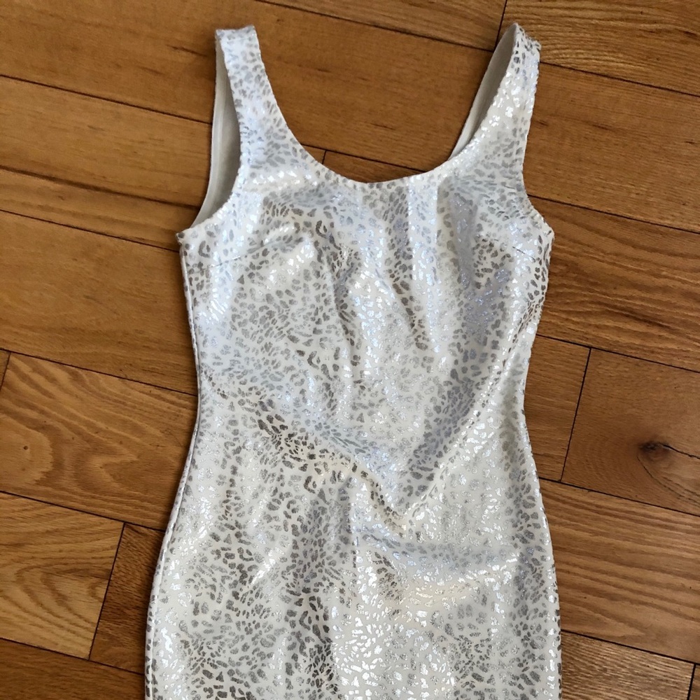Tight fitted white cheetah print dress.
